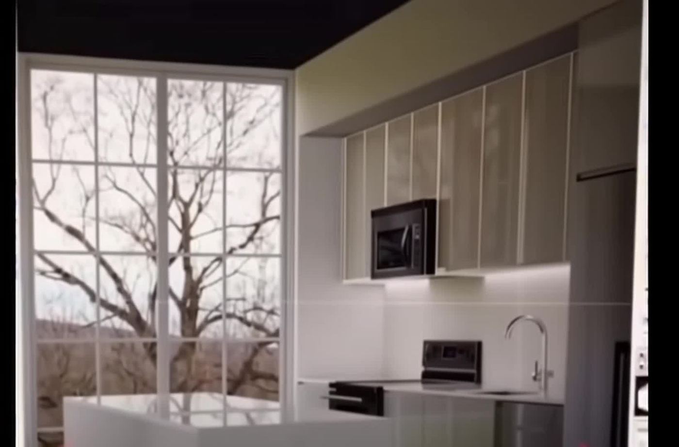 Photorealistic rendering of a finished kitchen with white cabinetry